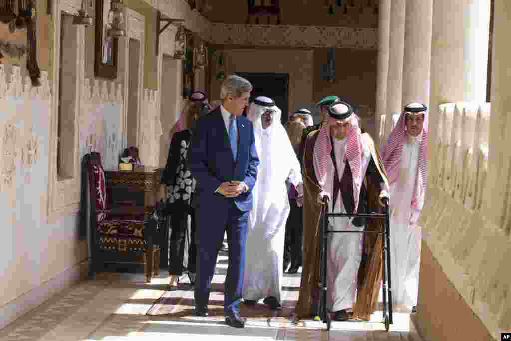 U.S. Secretary of State John Kerry walks with Saud bin Faisal bin Abdulaziz al-Saud, Foreign Minister of Saudi Arabia in Diriya, Saudi Arabia, March 5, 2015.
