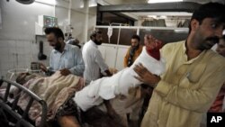 Man receives treatment after being injured by suicide bombing in Peshawar, Pakistan 23 Aug 2010.