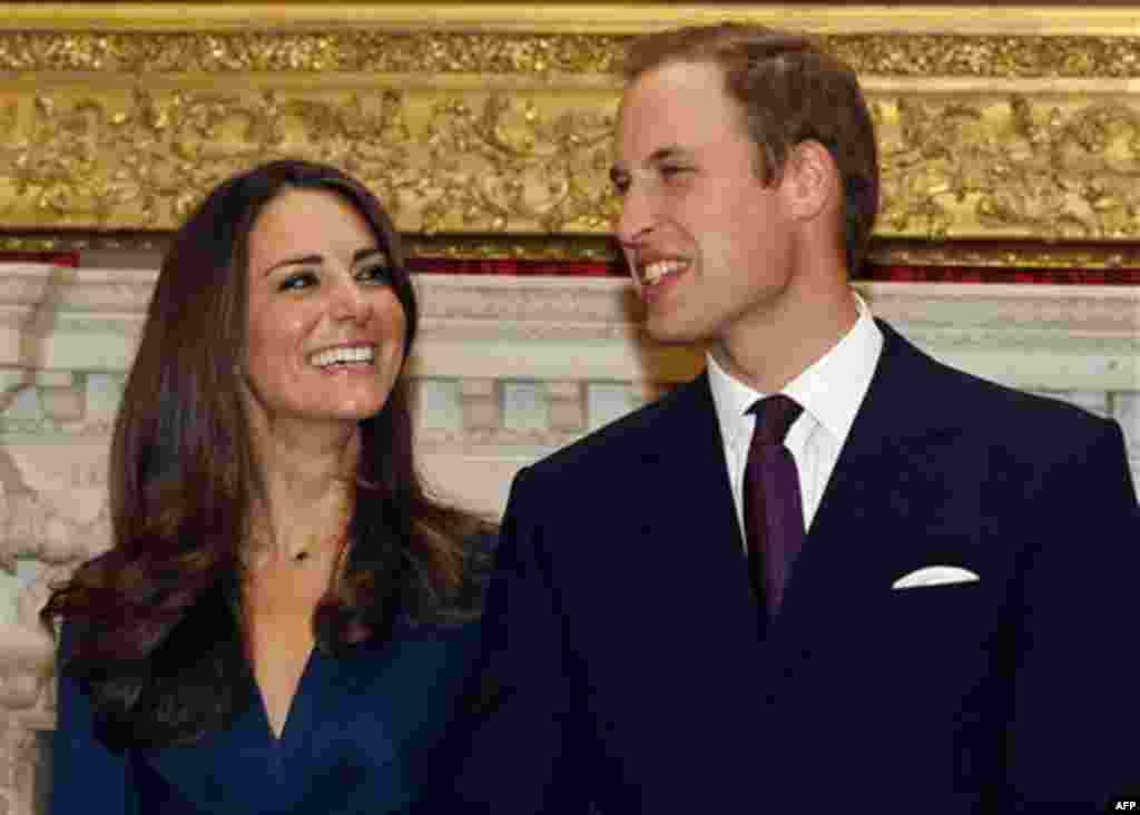 Britain's Prince William and his fiancee Kate Middleton pose for a media photocall, at St. James's Palace in London, Tuesday Nov. 16, 2010, after they announced their engagement. The couple are to wed in 2011. (AP Photo/Kirsty Wigglesworth)