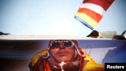 A portrait of Dorjee Khatri, who lost his life in an avalanche at Mount Everest last Friday, is seen on the truck carrying his body during the funeral rally of Nepali Sherpa climbers in Kathmandu, Apr. 21, 2014. 