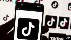The TikTok logo is seen on a cellphone on in Boston, Oct. 14, 2022.