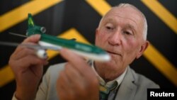 Michael Kelly holds a Lockheed Martin Tristar 500, an Aer Lingus model aircraft that is part of his collection, the world's largest, of diecast model aircraft unveiled at Shannon airport in Shannon, Ireland, Sept. 25, 2018. 