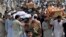 People carry the coffins of the victims of a suicide bombing at an election rally for burial in Peshawar, Pakistan, July 11, 2018. The Pakistani Taliban claimed responsibility for an overnight suicide bombing at a rally that killed a secular politician and 20 others two weeks before nationwide elections.