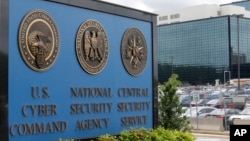 FILE - The National Security Agency in Fort Meade, Maryland, says it will no longer collect Americans' emails and text messages that mention a foreign national targeted for surveillance.