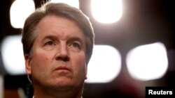 FILE - U.S. Supreme Court nominee Brett Kavanaugh listens during his Senate Judiciary Committee confirmation hearing on Capitol Hill in Washington, Sept. 4, 2018. 