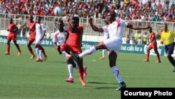 FILE - Malawi, in red, plays against Guinea during the Africa Cup of Nations qualifiers at Kamuzu Stadium in Blantyre in 2016. (Photo courtesy of Patrick Lunda)