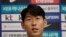South Korean national soccer team player Son Heung-min answers a reporter's question upon his arrival after the soccer match against North Korea, at Incheon International Airport in Incheon, South Korea, Thursday, Oct. 17, 2019.