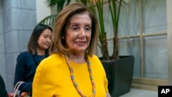 Speaker of the House Nancy Pelosi, D-Calif., arrives for a gathering of the House Democratic Caucus at the Capitol in Washington, Sept. 10, 2019. 