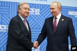 United Nations Secretary-General Antonio Guterres and Russian President Vladimir Putin shake hands during a meeting on the sidelines of the BRICS Summit in Kazan, Russia, Oct. 24, 2024. (Alexander Kazakov, Sputnik, Kremlin Pool Photo via AP)