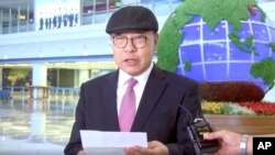 In this image made from video taken on July 6, 2019, by Uriminzokkiri website, shows Choe In-guk giving a statement upon his arrival at Pyongyang's international airport.