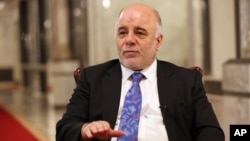 FILE - Iraqi Prime Minister Haider al-Abadi is seen speaking to the media.