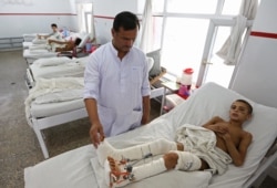 Afghan child war victims receive treatment at the Emergency Hospital in Kabul, Afghanistan, July 25, 2016.
