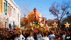 People take part in the 92nd annual Macy's Thanksgiving Day Parade in New York, Thursday, Nov. 22, 2018.