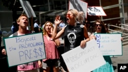 Demonstrators protest outside the Comcast Center in Philadelphia, July 27, 2016, during the third day of the Democratic National Convention. 