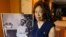 Josephine Bolling McCall poses with a photo of her father, lynching victim Elmore Bolling, at her home in Montgomery, Alabama, April 18, 2018. Bolling is among thousands of lynching victims remembered at the new National Memorial for Peace and Justice, erected with donations by the Alabama-based Equal Justice Initiative. The memorial and an accompanying museum, which aim to tell the story of racial oppression in the United States, open April 26.