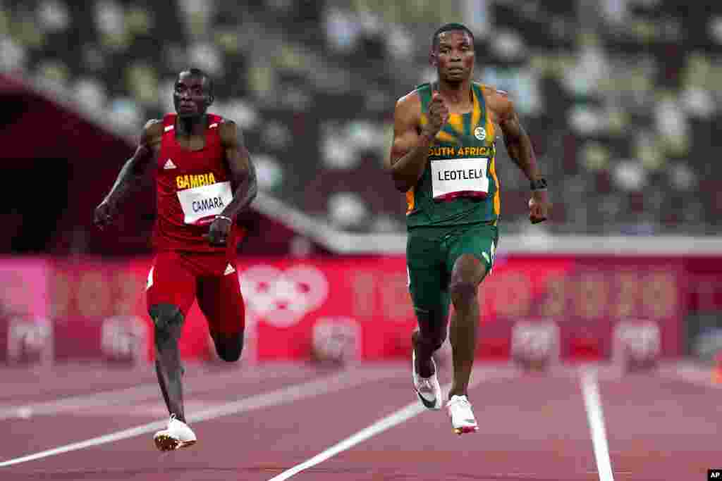 Gift Leotlela, of South Africa, right, wins a heat in the men&#39;s 100-meter run at the 2020 Summer Olympics, Saturday, July 31, 2021, in Tokyo. (AP Photo/Petr David Josek)