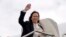 US Vice President and Democratic presidential candidate Kamala Harris waves as she boards Air Force Two at San Francisco International Airport on August 11, 2024,in San Francisco, California, as she returns to Washington, DC.