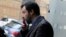 FILE - Northern League's leader Matteo Salvini smokes a cigarette during an electoral rally in Palermo, Italy Feb. 14, 2018.
