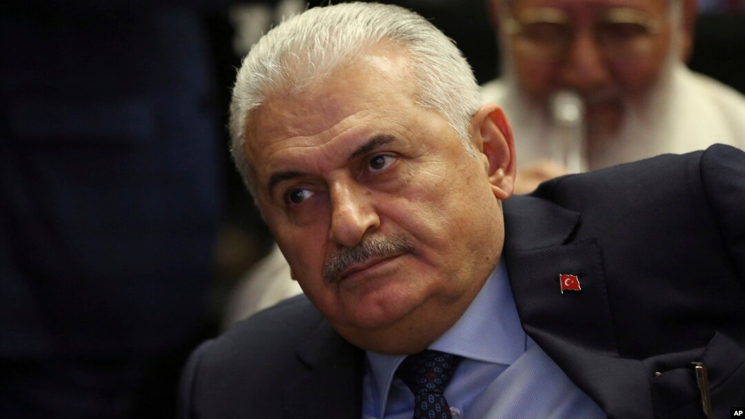 FILE - Binali Yildirim, Turkey's Transportation Minister and founding member of Turkey’s governing AKP party, participates in a meeting in Ankara, Turkey, May 12, 2016.