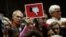 A voter holds up a sign during a town hall meeting with constituents by U.S. Representative Leonard Lance, R-N.J., in Cranford, New Jersey, May 30, 2017.