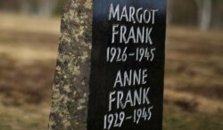 FILE - A memorial stone for Margot Frank and Anne Frank is pictured on the grounds of the former Prisoner of War (POW) and concentration camp Bergen-Belsen, March 18, 2020.