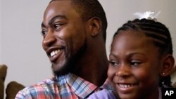 Adrian Arrington, a former safety at Eastern Illinois University, talks about enduring five concussions while playing, some so severe he couldn't recognize his parents afterward, at his home, Bloomington, Ill, July 29, 2014.
