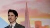 FILE - Canada's Prime Minister Justin Trudeau waits to speak at the AppDirect office in San Francisco, Feb. 8, 2018. 