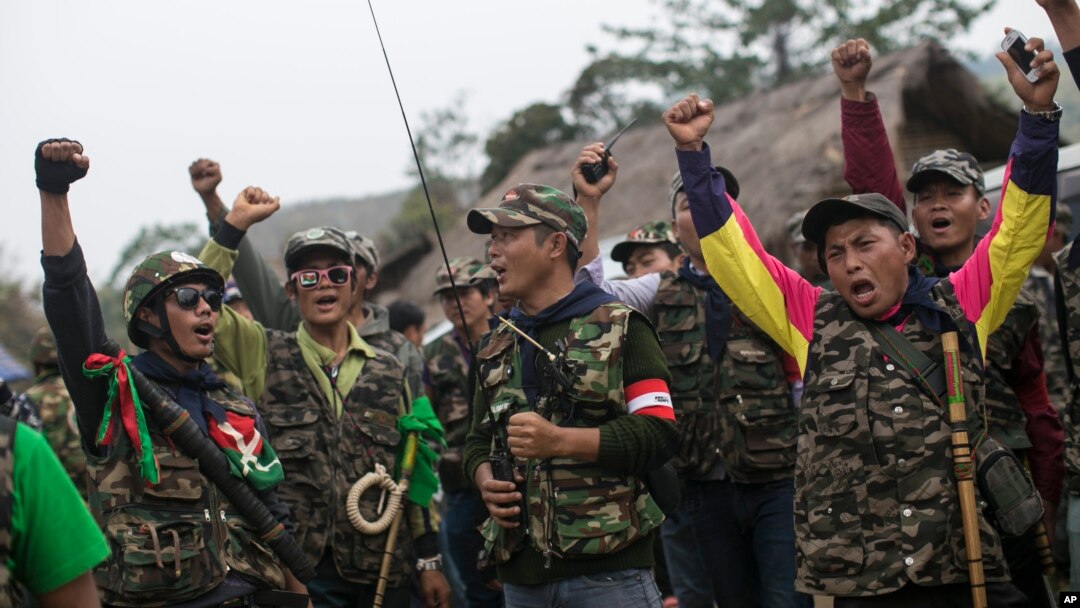 Members of community based anti-narcotic campaigners known as The Pat Jasan shout slogans protesting against the government’s ban prohibiting the group from destroying poppy farms in Wai Maw, northern Kachin State, Myanmar, Feb. 21, 2016.