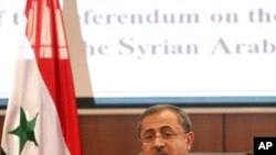 Syria's Interior Minister Mohammed al-Shaar announces the results of the referendum on a new constitution in Damascus, February 27, 2012.