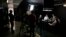 The director of NC Noticias, Manuel Bolivar, left, attends the broadcast of a debate show, at the studio of the new online news network launched by ex-combatants of the Revolutionary Armed Forces of Colombia, FARC, in Bogota, Colombia, Nov. 14, 2107.
