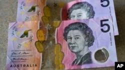 FILE - Australian $5 notes are pictured in Sydney on Sept. 10, 2022. King Charles III won’t feature on Australia's new $5 bill, the nation's central bank announced Thursday, Feb. 2, 2023.