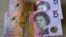 FILE - Australian $5 notes are pictured in Sydney on Sept. 10, 2022. King Charles III won’t feature on Australia's new $5 bill, the nation's central bank announced Thursday, Feb. 2, 2023.