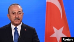 FILE - Turkish Foreign Minister Mevlut Cavusoglu gives a statement to the media following a meeting with German Foreign Minister Heiko Maas at the Foreign Ministry in Berlin, Germany, May 6, 2021. (Reuters/Annegret Hilse/Pool)