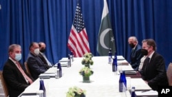 U.S. Secretary of State Antony Blinken, right, meets with Pakistani Foreign Minister Shah Mahmood Qureshi on the sidelines of the 76th U.N. General Assembly in New York City, Sept. 23, 2021. 