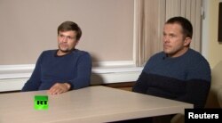 FILE - A still image taken from video footage and released by Russia's RT international news channel Sept. 13, 2018, shows two Russian men identified as Alexander Petrov and Ruslan Boshirov during an interview at an unnamed location.