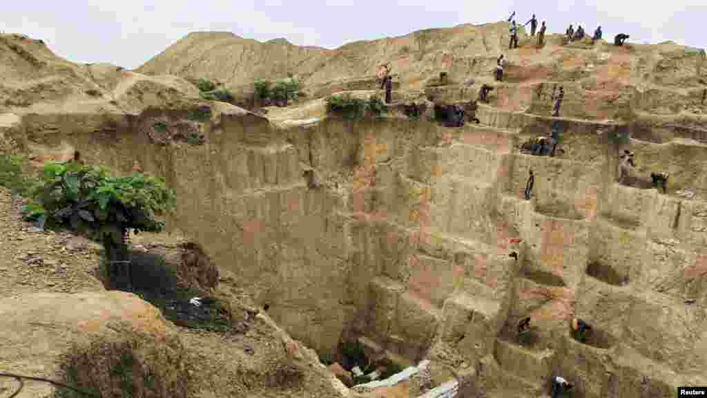 Labourers work at one of the pits of a gold mine in Minna, Niger State.