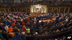 FILE - President Barack Obama is applauded as he gives his State of the Union address before a joint session of Congress in Washington, Jan. 12, 2016.