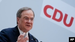 German Christian Democratic Union Party Chairman Armin Laschet briefs the media after a meeting of the party's board at the headquarters in Berlin, April 12, 2021.