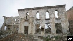 A view of a vast expanse of jagged concrete and houses reduced to shells in Aghdam, after the Azerbaijani forces handed control that had been occupied by Armenian forces for a quarter-century, Aghdam, Nov. 20, 2020.