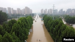 FILE - An aerial view shows a flooded road following heavy rainfall in Zhengzhou, Henan province, China, July 23, 2021.