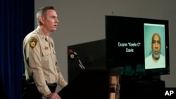 Las Vegas police Lt. Jason Johansson of the Homicide Section speaks beside a photo of Duane "Keffe D" Davis during a news conference on an indictment in the 1996 murder of Tupac Shakur, Sept. 29, 2023.