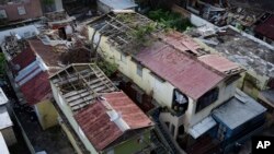 Some roofs damaged by Hurricane Maria are still exposed in San Juan, Puerto Rico, Nov. 15, 2017. The Department of Homeland Security will investigate how a tiny Florida company won more than $30 million in contracts for relief supplies and failed to deliver the tarps and plastic sheeting needed to cover tens of thousands of Puerto Rican homes.