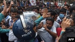 Activists scuffle with the police during a demonstration in Dhaka on March 1, 2021, following the death of writer Mushtaq Ahmed in jail months after his arrest.