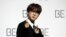 ARCHIVO - Jin, miembro de la banda surcoreana de K-pop BTS, posa para los fotógrafos durante una conferencia de prensa para presentar su nuevo álbum "BE" en Seúl, Corea del Sur, el 20 de noviembre de 2020.