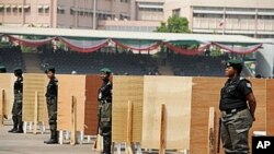 Police women stand in front of voting centres ahead of the presidential primaries of the ruling People Democratic Party in Abuja, 13 Jan 2011