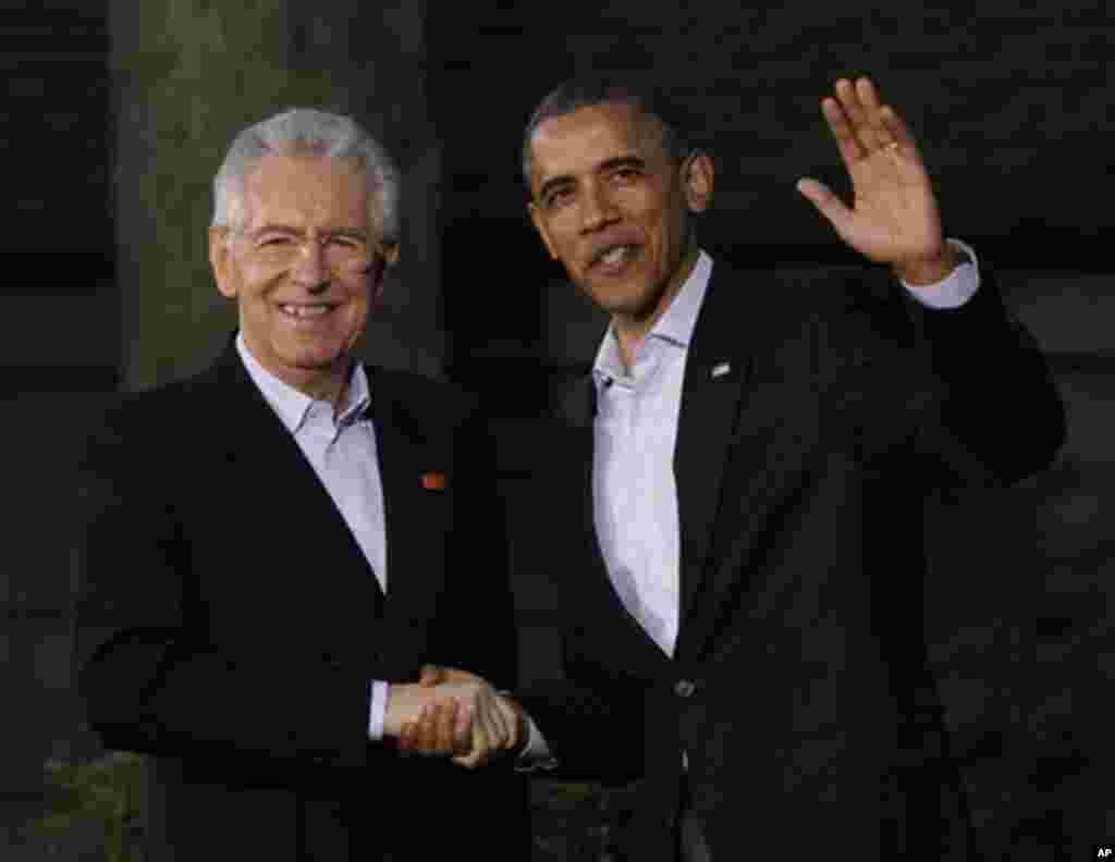 President Barack Obama, right, shakes hands with Italy's Prime Minister Mario Monti on arrival for the G8 Summit Friday, May 18, 2012 at Camp David, Md. (AP Photo/Charles Dharapak)