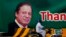 A motorcyclist drives past a billboard showing the portrait of Pakistani Prime Minister Nawaz Sharif at a main highway in Islamabad, Pakistan, July 10, 2017.