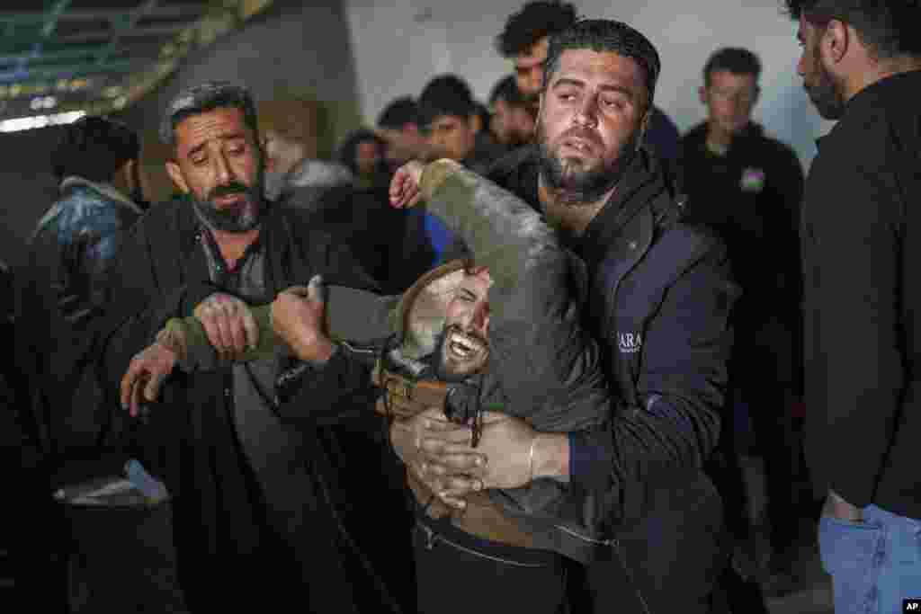 A man mourns during the death of Ibrahim al-Hamad, who was killed by a Turkish-backed militia, during the funeral of four Syrian Democratic Forces fighters in the village of Daoudiya in northeastern Syria&#39;s Hassakeh province.