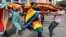Members of the LGBT community dance to celebrate after the country's top court struck down a colonial-era law that made homosexual acts punishable by up to 10 years in prison, in Bangalore, India, Sept. 6, 2018. 
