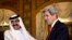 U.S. Secretary of State John Kerry (R) is greeted by Qatari Emir Hamad bin Khalifa al-Thani at Wajbah Palace in Doha, June 23, 2013.